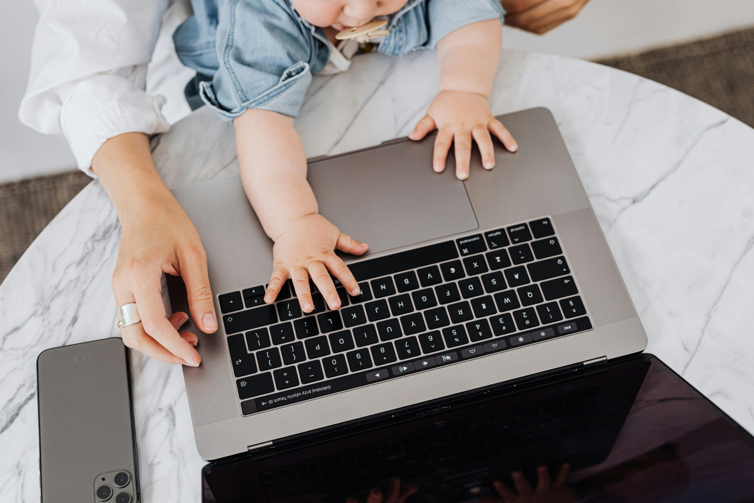 Mama and Baby working on a computer